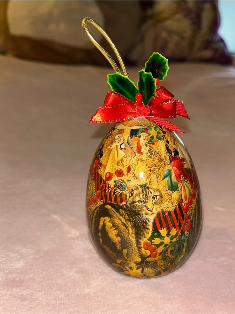 Vintage egg shaped Christmas ornament with cat in festive scene